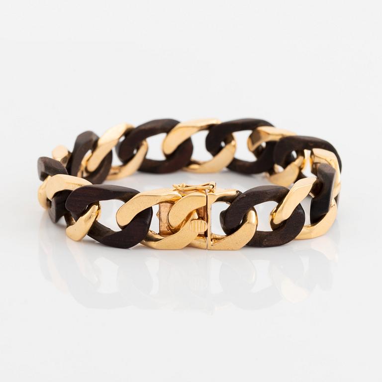 A Van Cleef & Arpels 18K gold and wood bracelet.