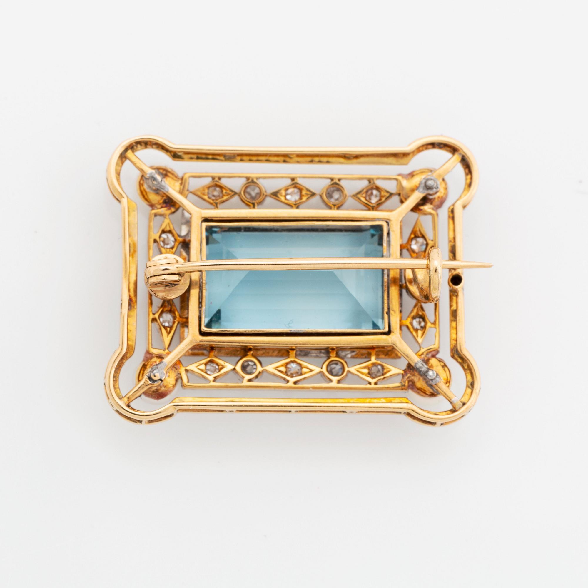 An 18K gold and enamel brooch set with a faceted aquamarine, pearls and old-cut diamonds.