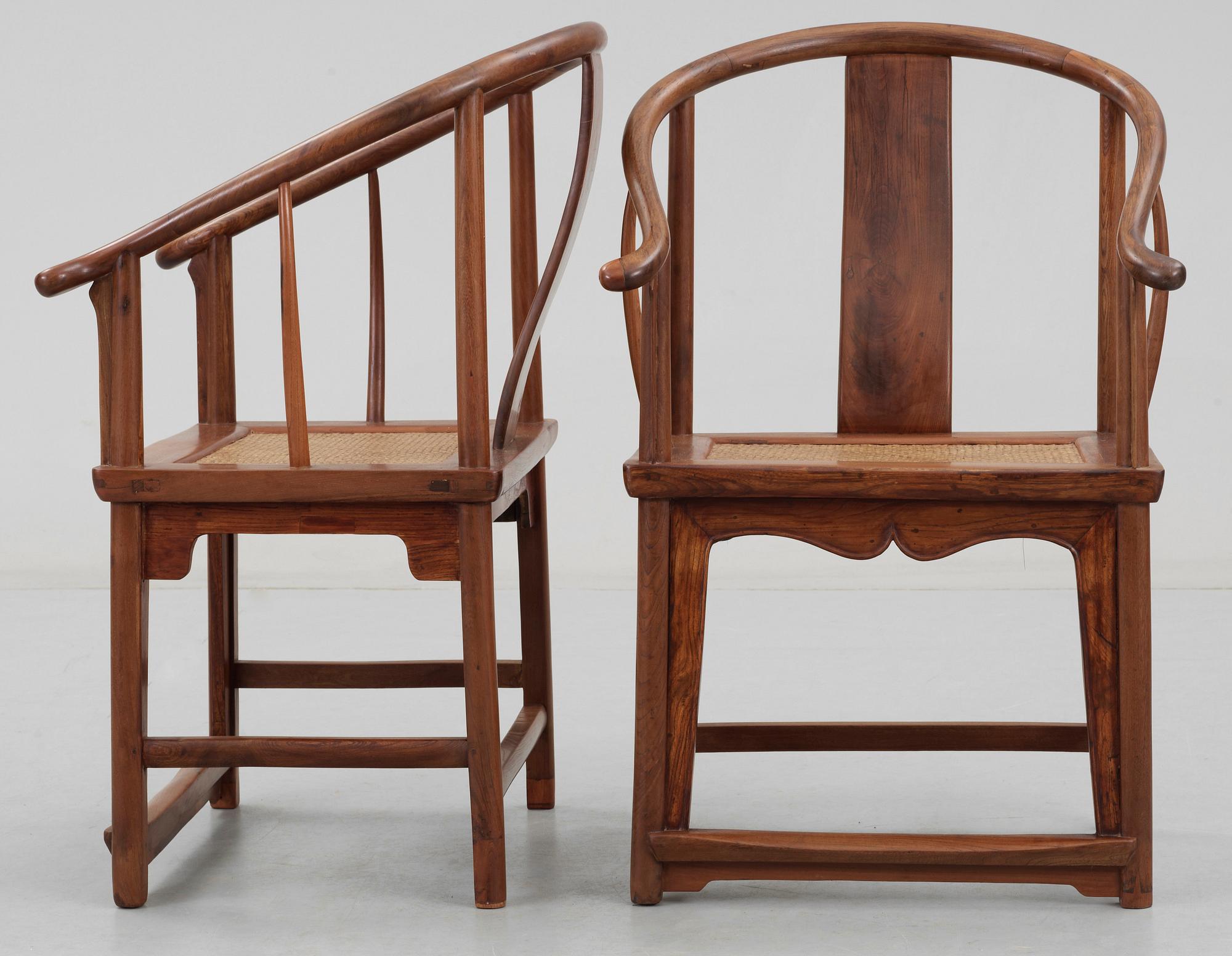 A pair of hardwood horseshoeback armchairs, Qing dynasty.