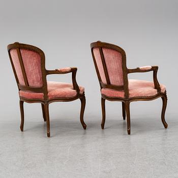 A pair of 19th-century rococo revival arm-chairs.