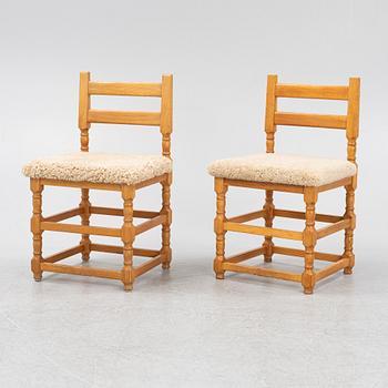 A set of eight pine chairs with new sheepskin upholstery, 1970s.