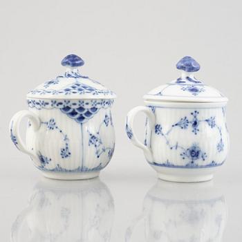 Two 'Blue Fluted' / 'Musselmalet rifflet' porcelain cream cups with covers, Royal Copenhagen, 19th century and 1964.