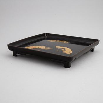 Two Japanese red and black hiramakie lacquer trays, first half of the 20th century.