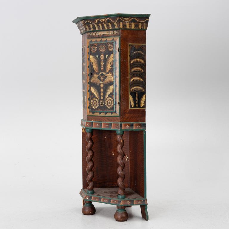 Corner cabinet, dated 1800.