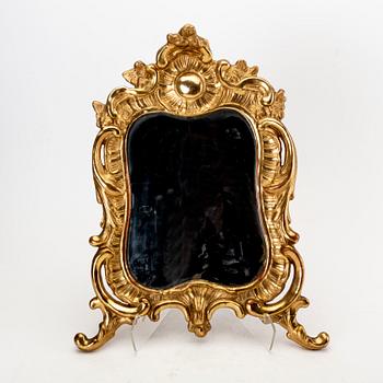 A mid 18th century gilded rococo mirror.