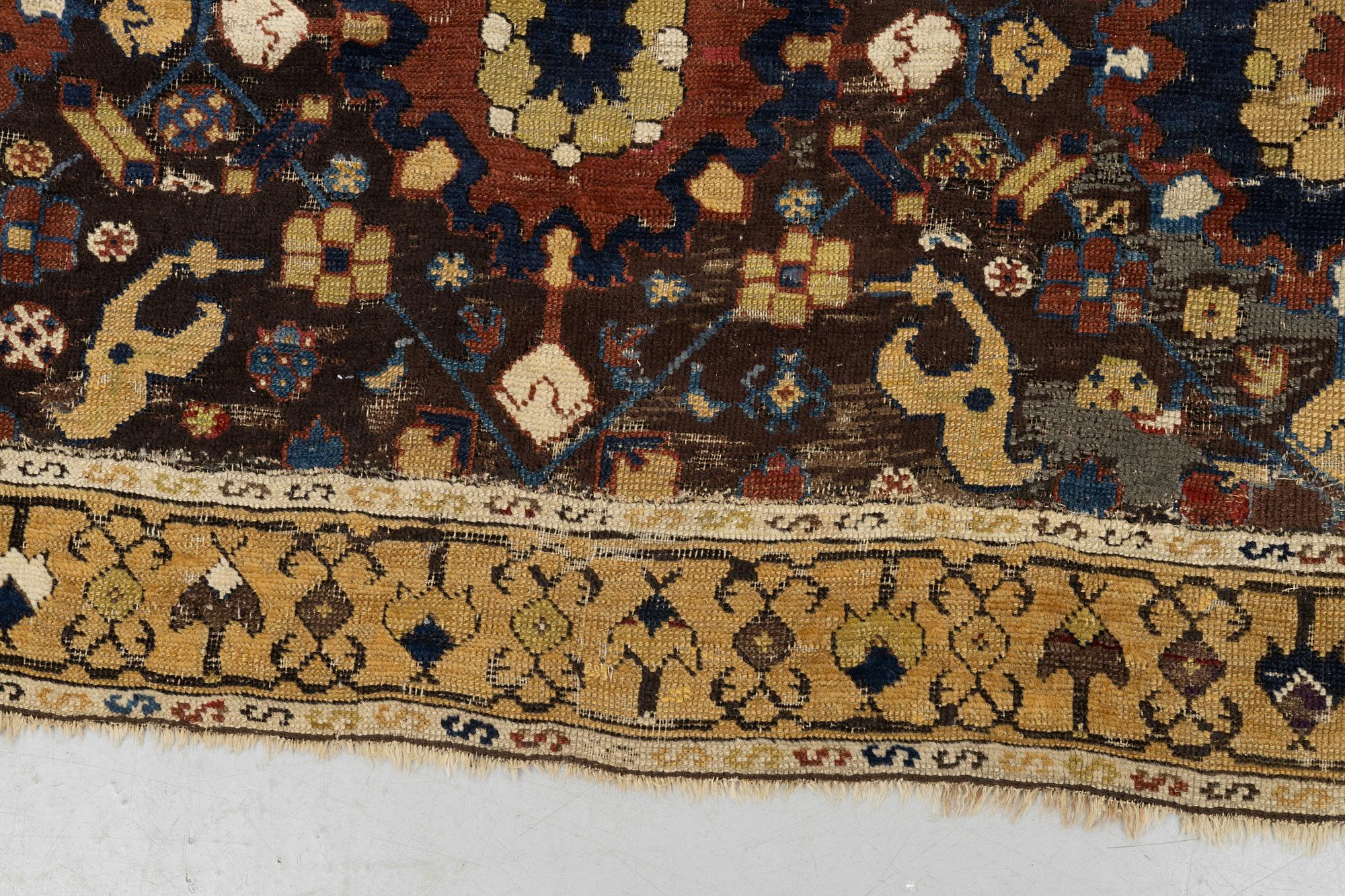 A carpet, fragment, an antique Karabagh 18th century, ca 293-300,5 x 202,5-205,5 cm.