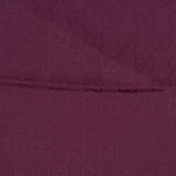 Gucci, a wool and silk mix "GG" jaquard shawl.