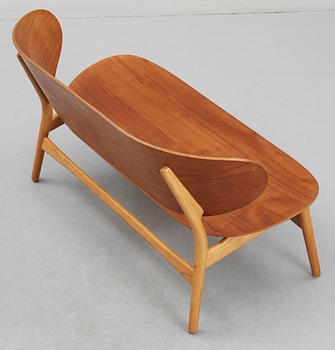 A Hans J Wegner teak and beech 'Shell' settee by Fritz Hansen, Denmark, 1950's.