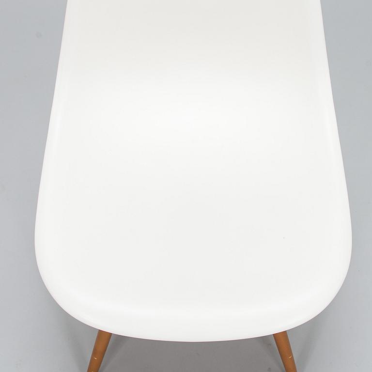 A 'Plastic chair DSW' by Charles and Ray Eames for Vitra.