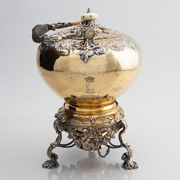 An English silver-gilt teapot with stand and burner, mark of Richard Sibley I, London 1825.