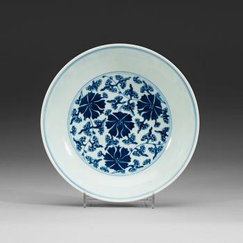 A set of four blue and white lotus dishes, Qing dyanasty with Qianlong sealmark.