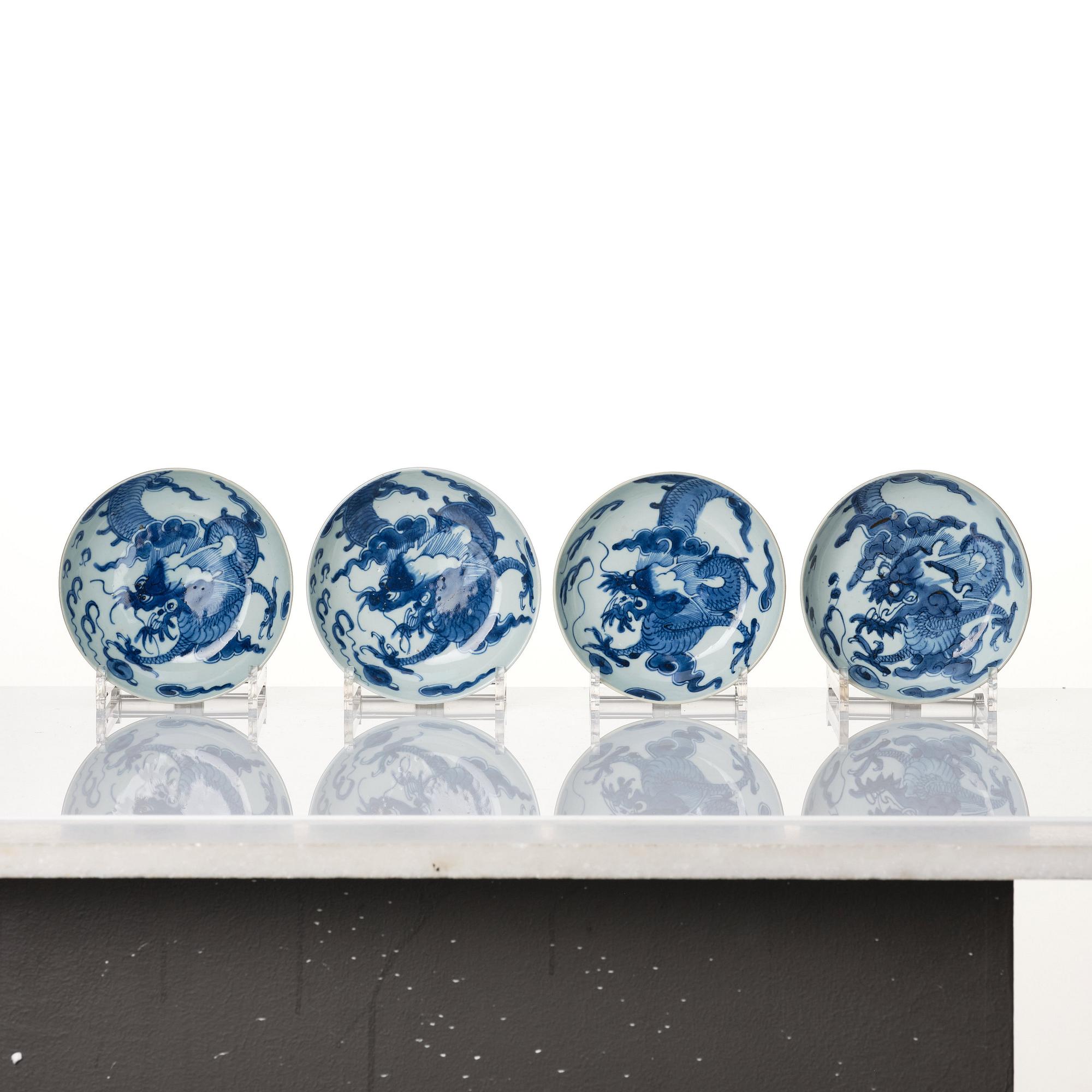 A set of four blue and white dragon dishes, Qing dynasty, 18th Century.