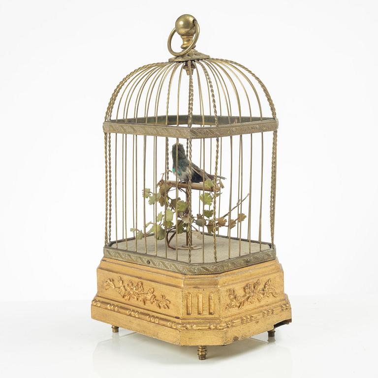 A music box in the shape of a bird's cage, France, late 19th century.