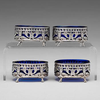 A Belgian set of four 19th century silver and glass salts, marks are Hanau Pseudo marks of "Wolf & Knell", after 1887.