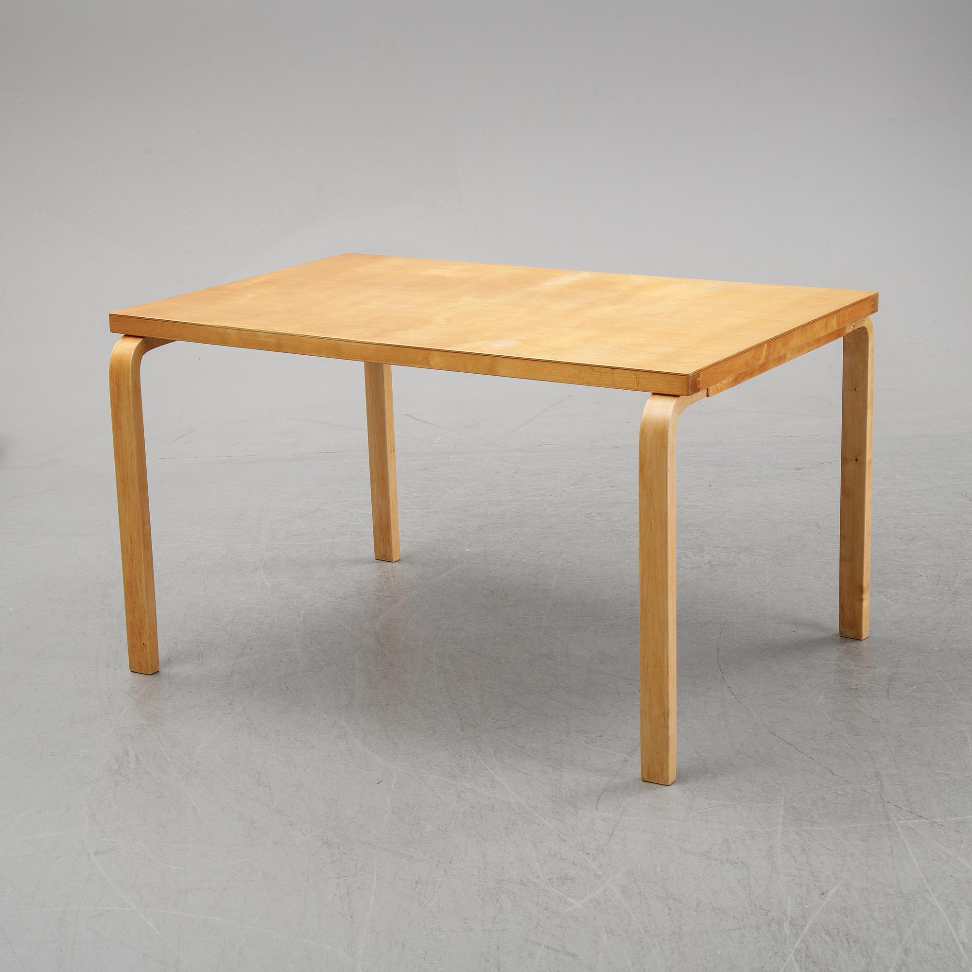 Alvar Aalto, a birch dining table, Artek, Finland, mid 20th Century.