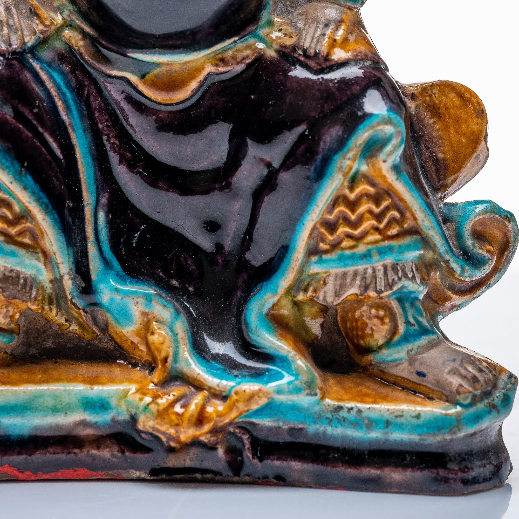 A pottery figure of a the warrior god Guandi, Ming dynasty (1368-1644).