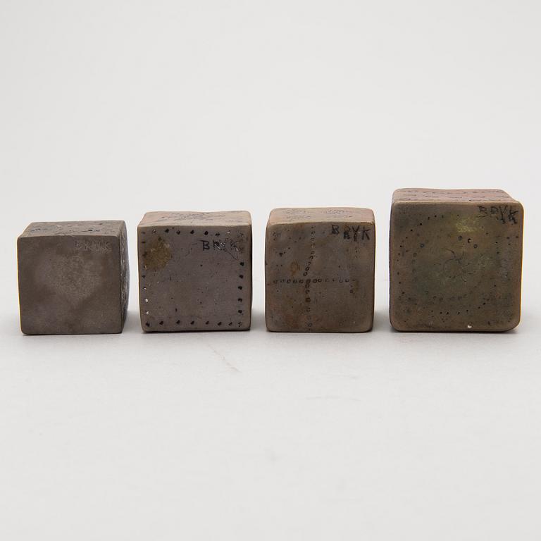 Four stoneware cruets, signed Bryk.