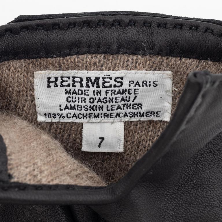 Hermès, a pair of black 'Kelly' kidskin and lambskin gloves, french size 7.