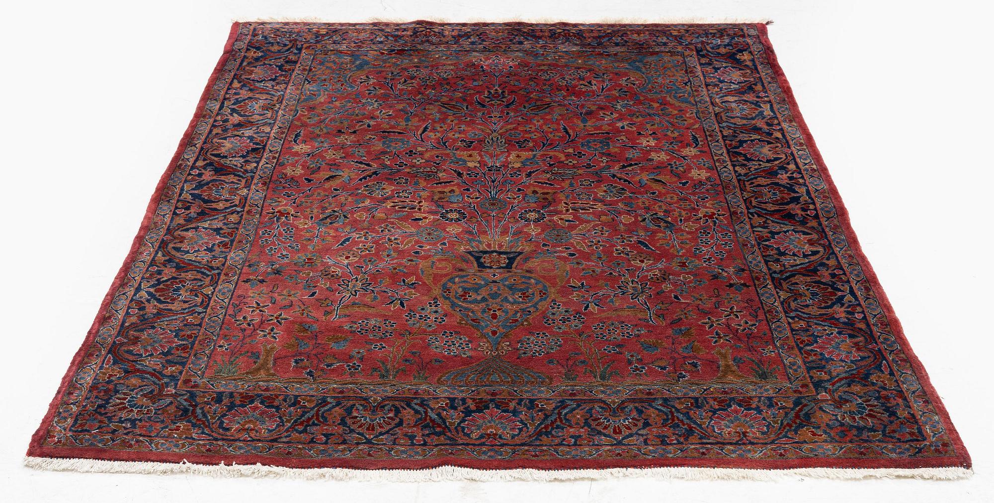 An antique Manchester Kashan rug, c. 197 x 126 cm.