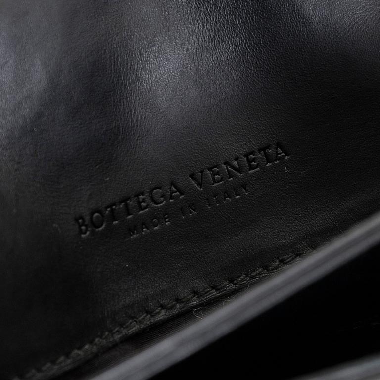 Bottega Veneta, a briefcase.