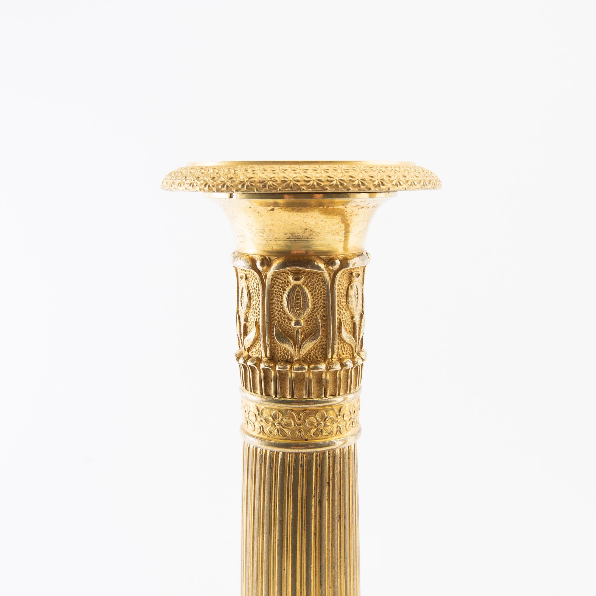 A pair of candlesticks, Empire France first half of the 19th century.