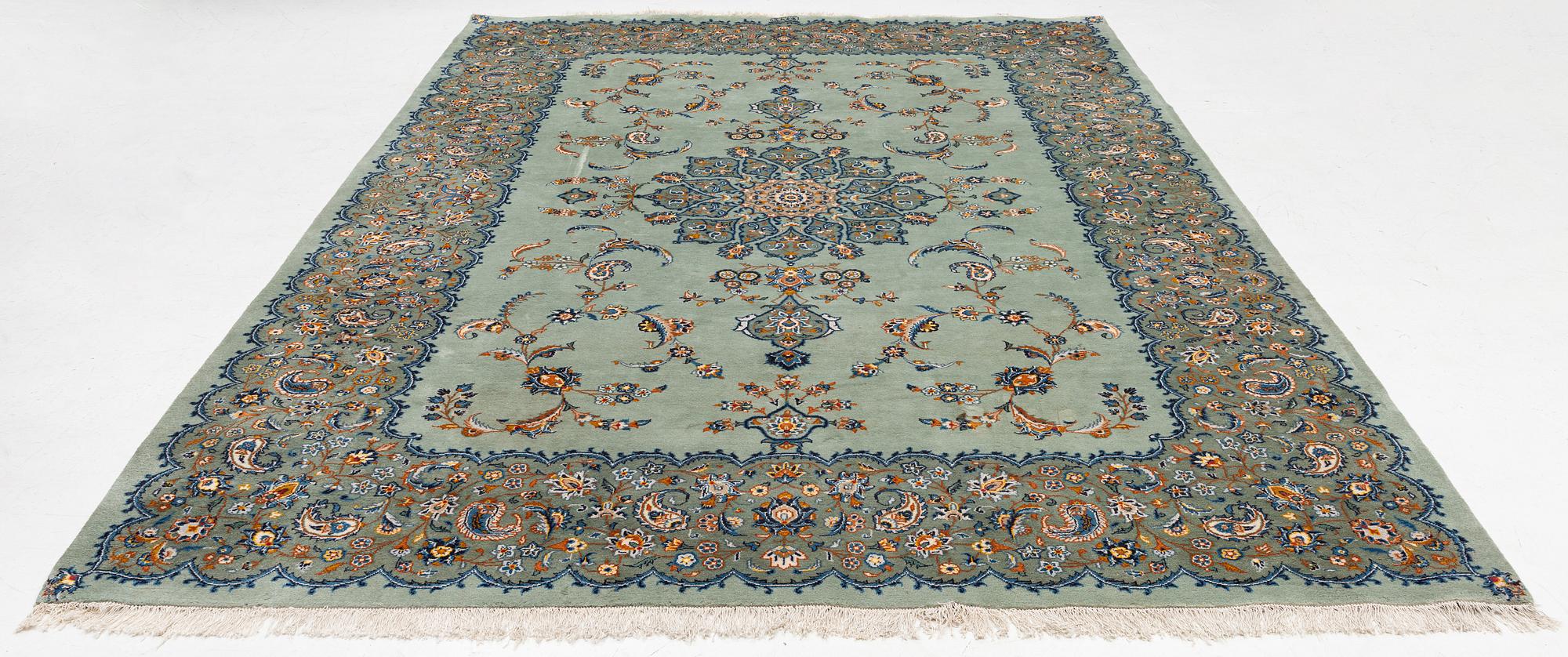 A Keshan carpet, signed, c. 376 x 270 cm.