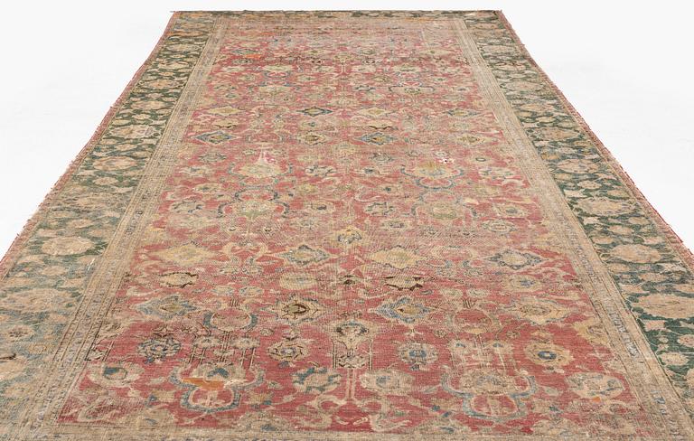 A safavid 'Spiral vine' Esfahan carpet, central persia, mid to second haft of the 17th century. Ca 562 x 231 cm.