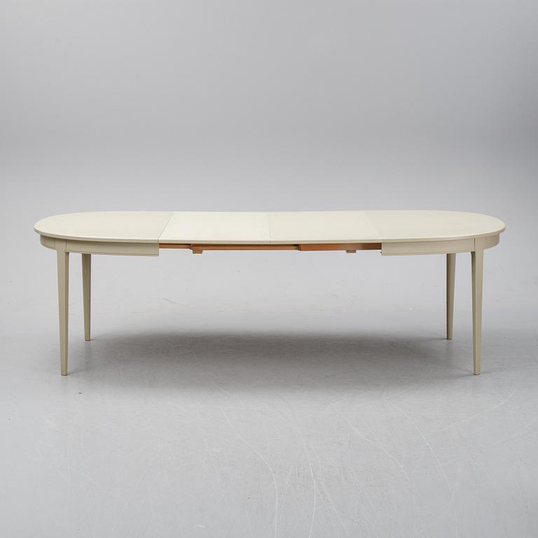 A dining table with two armchairs and six chairs by Carl Malmsten for Bodafors.