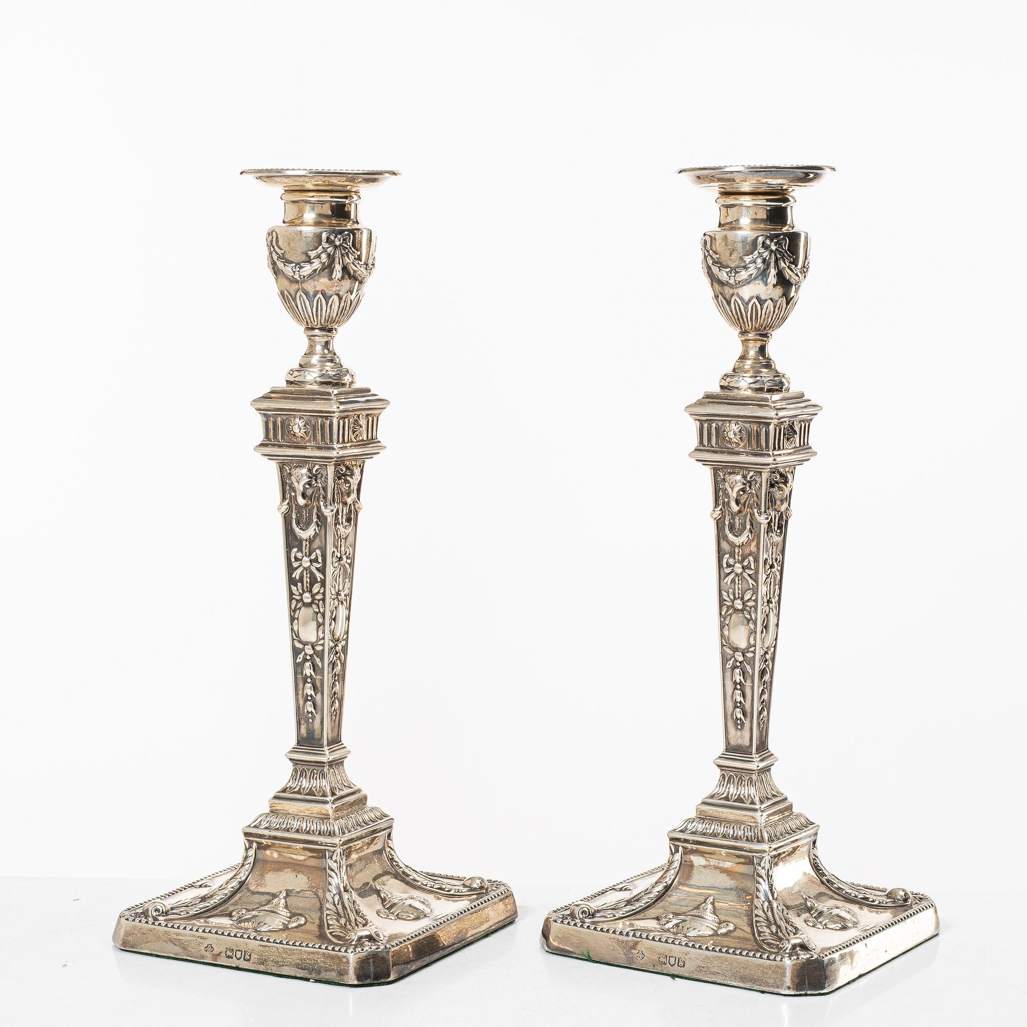 A pair of English silver candlesticks, mark of William Hutton & Sons Ltd, London 1902.