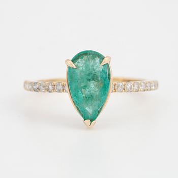 Pear shaped emerald and brilliant-cut diamond ring.