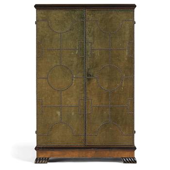 225. Otto Schulz, a velvet covered Swedish Modern cabinet, Sweden, late 1920s.