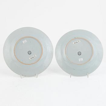 A set of five Chinese porcelain famille rose plates and one 'double peacock' plate, Qing dynasty, Qianlong (1736-95).