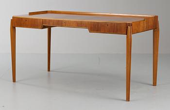 A Carl-Axel Acking mahogany and walnut desk, Sweden 1940's-50's.