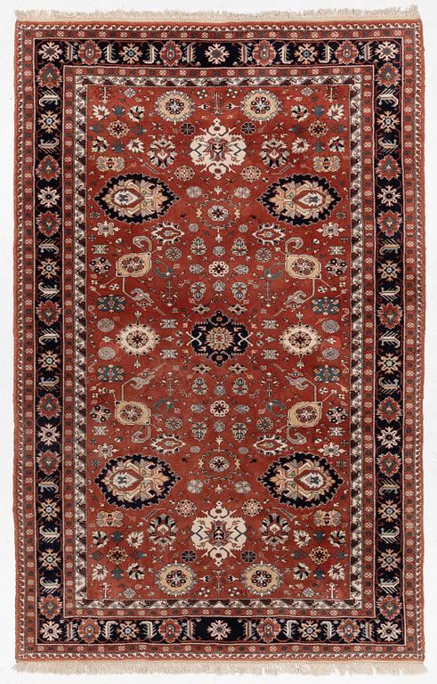 A semi-antique Orientall carpet c. 318 x 202 cm.