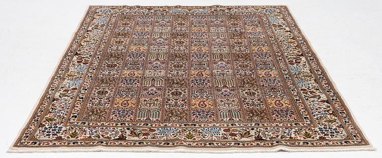 A Moud carpet, part silk, approx. 285 x 195 cm.