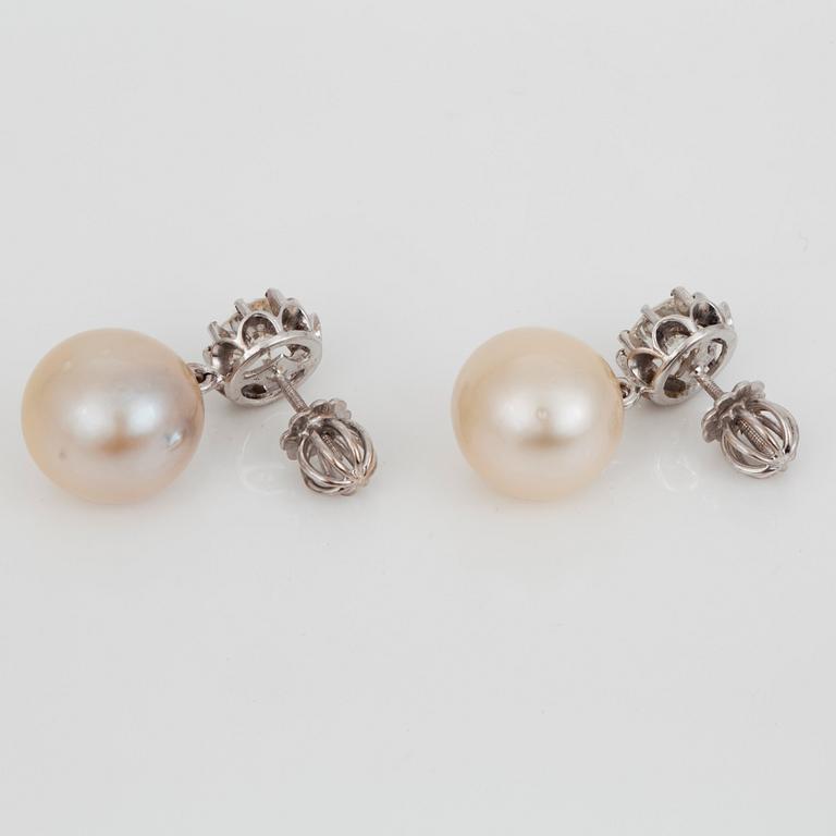 A pair of cultured pearl and diamond, ca 0.90 ct/pcs, earrings.