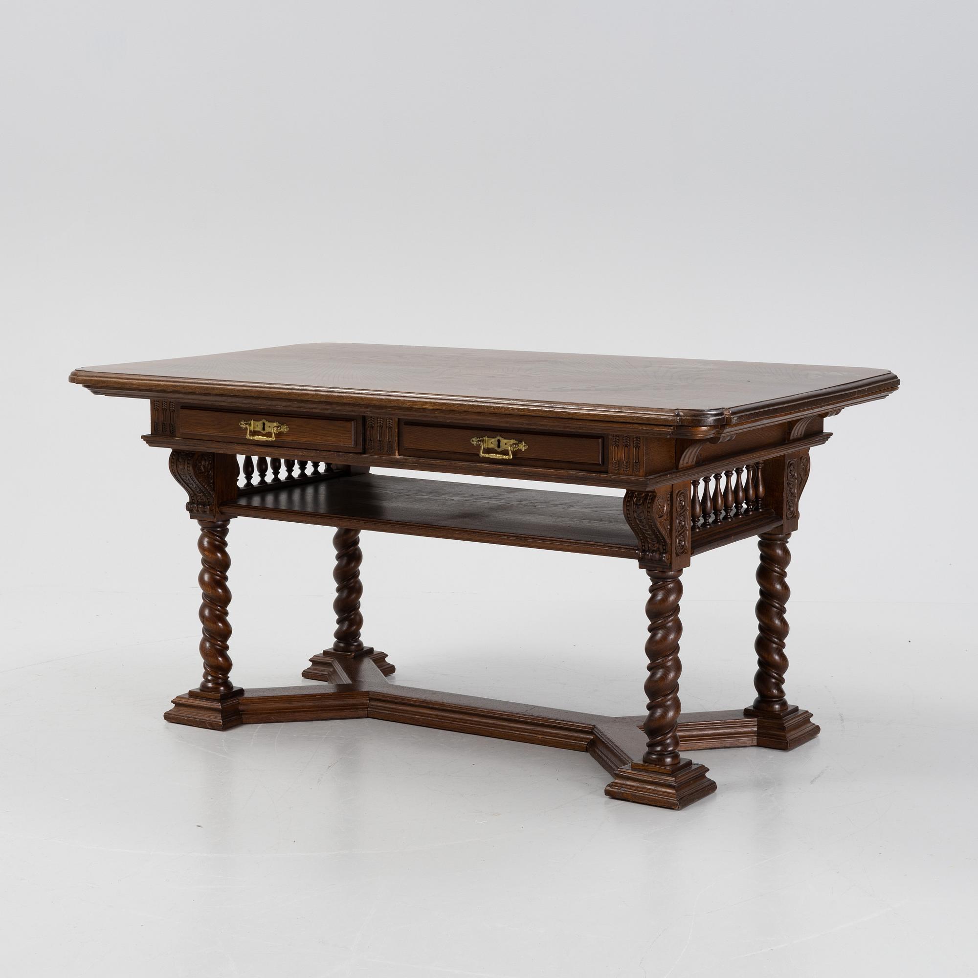 A writing desk / library table, circa 1900.