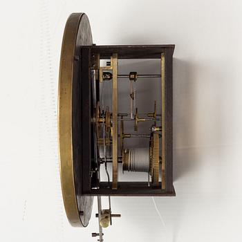 A walnut long case clock, from around the year 1900.