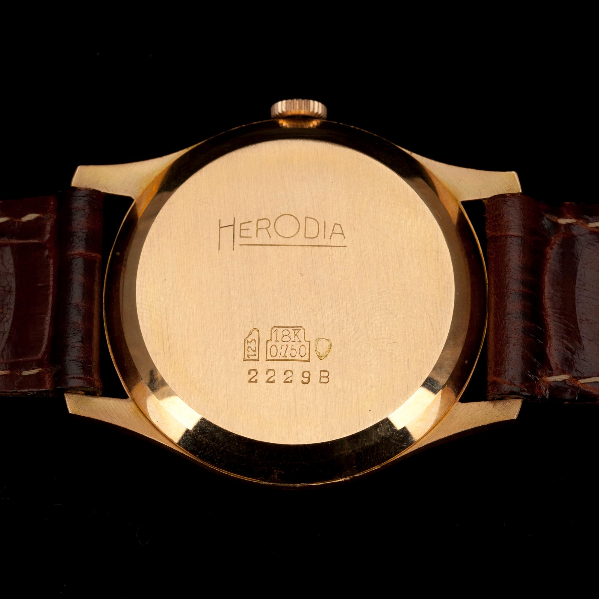 HERRARMBANDSUR, "Herodia" guld 18K, läderrem, Schweitz 1950-tal.