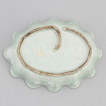 A Chinese celadon glazed lotus leaf shaped bowl, late Qing dynasty, and a ge-glazed brush washer, possibly 20 century.