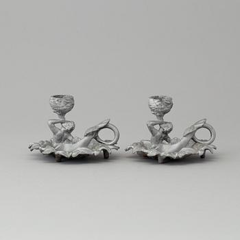A pair of cast iron candlesticks, marked Verlag bei, A. Meves, Berlin, late 20th century.
