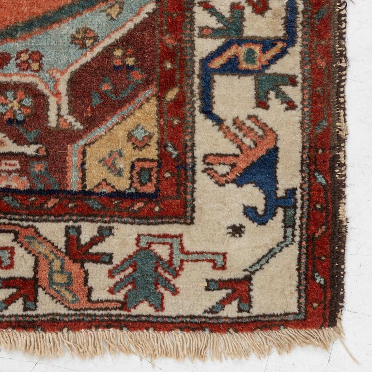 A Heriz rug, c. 192 x 133-139 cm.