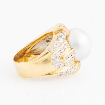 Cultured pearl and brilliant cut diamond ring.