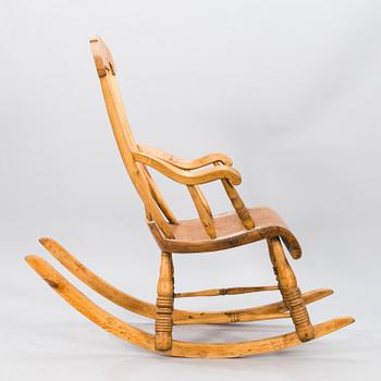 A Wooden Rocking Chair.