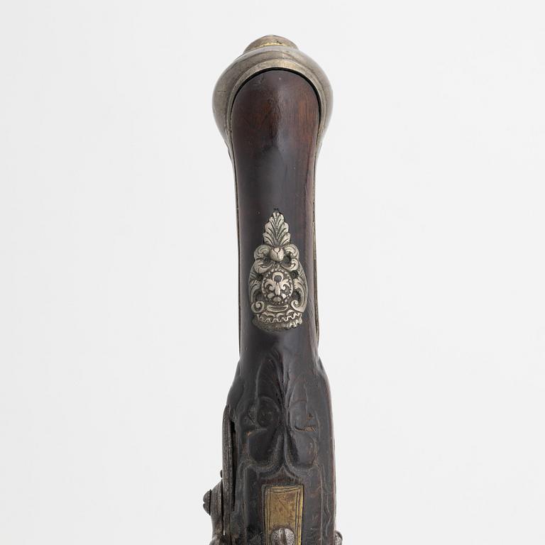 A 18th Century flintlock pistol.