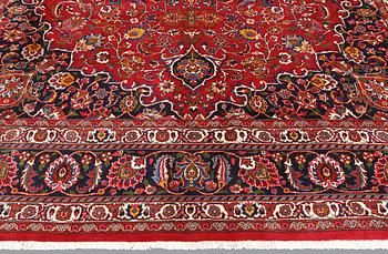 A signed Mashad carpet, ca 375 x 303 cm.