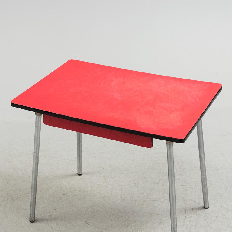 A mid 20th century table and chair.
