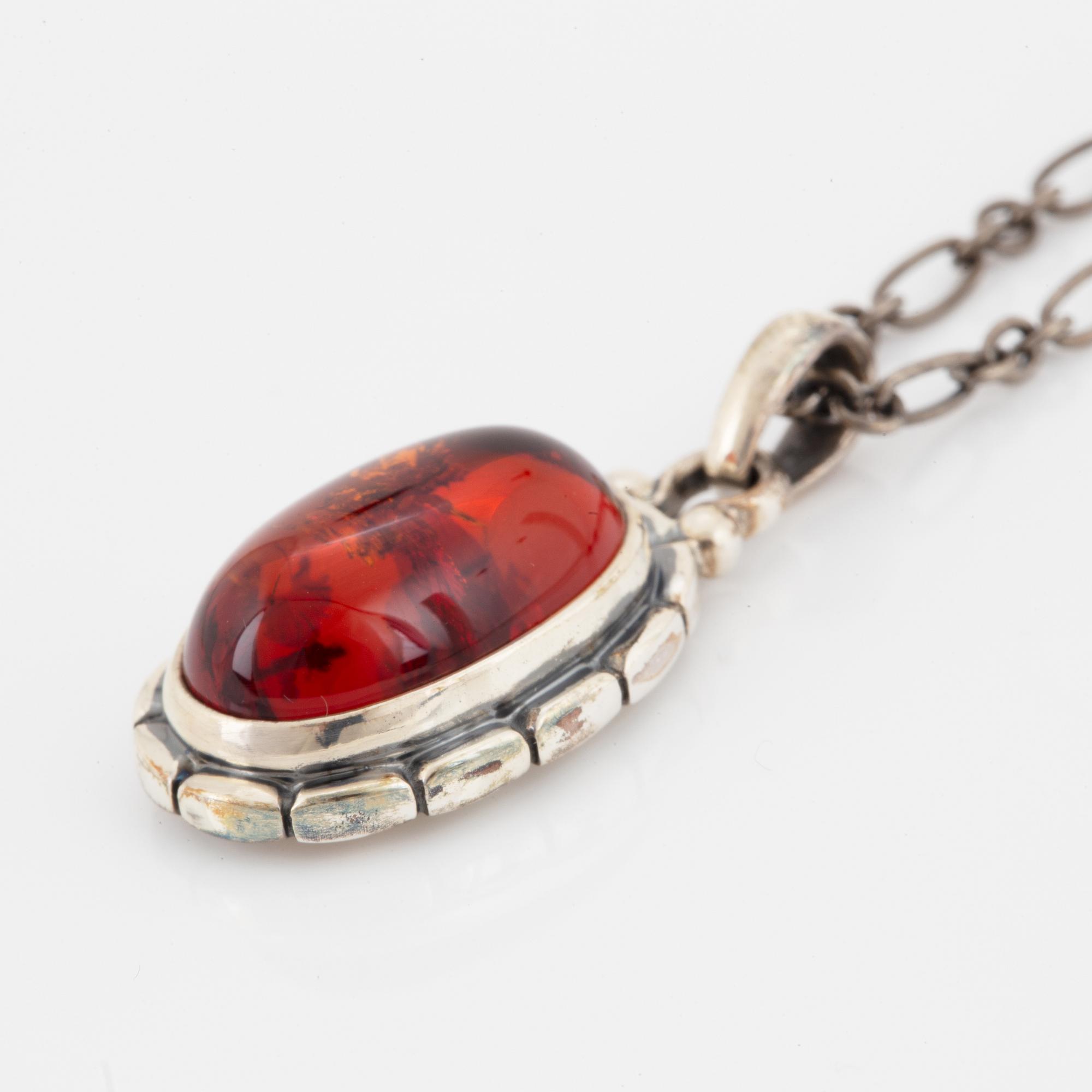 A Georg Jensen silver and cabochon-cut amber necklace.