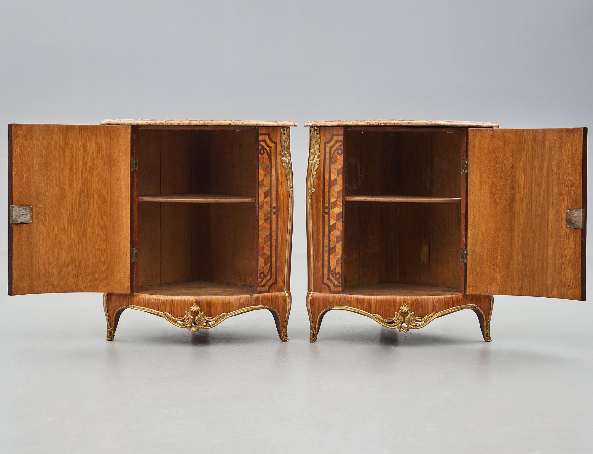 A pair of Louis XV 18th century corner cupboards by Léonard Boudin (1735-1804), master in Paris 1761.
