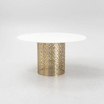 Jonathan Adler, a 'Nixon' marble and brass dining table.